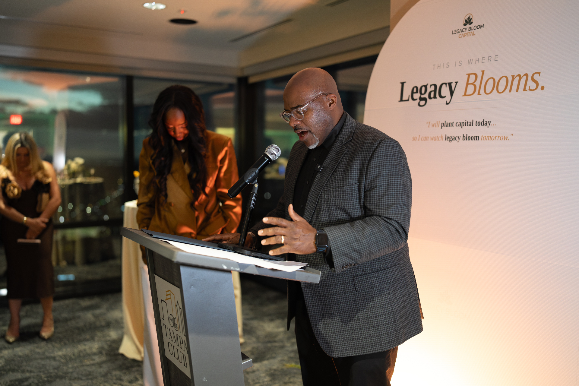 A pastor prays a blessing over Legacy Bloom Capital.